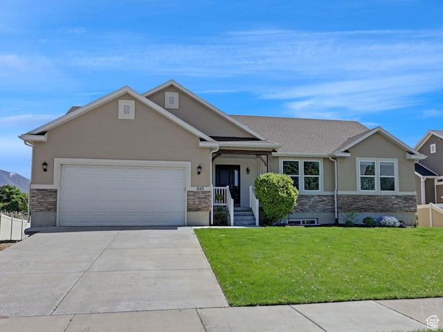 1350 S 849 W Unit 17D, Springville, UT 84663 - view of front of property with stone siding, stucco siding, driveway, and a garage