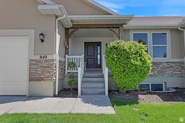 1350 S 849 W Unit 17D, Springville, UT 84663 - doorway to property with stone siding, a garage, and stucco siding