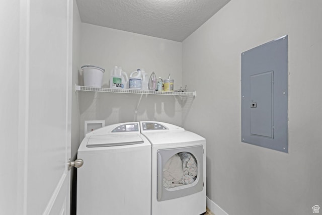 1350 S 849 W Unit 17D, Springville, UT 84663 - laundry room featuring electric panel, washing machine and dryer, a textured ceiling, and baseboards