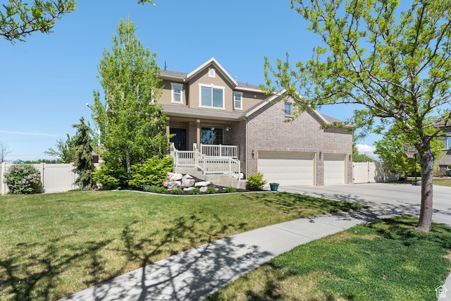 view of front of home featuring a porch, a garage, fence, and driveway
