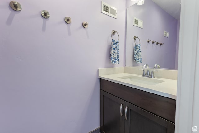 bathroom featuring vanity and visible vents