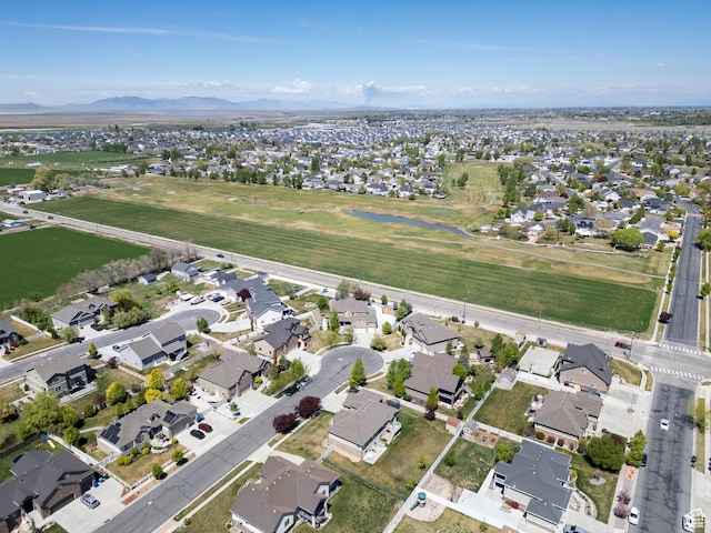 drone / aerial view with a residential view and a mountain view