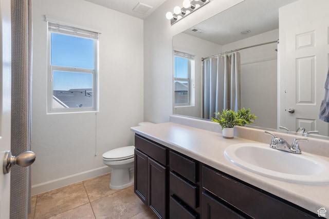 full bathroom featuring vanity, toilet, tile patterned floors, baseboards, and visible vents