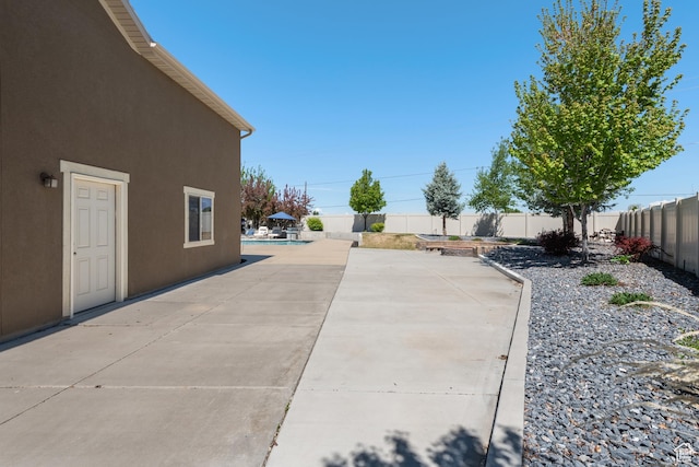 view of patio / terrace with a fenced backyard and a fenced in pool