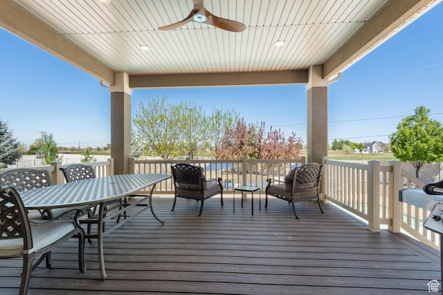 deck featuring ceiling fan and outdoor dining space