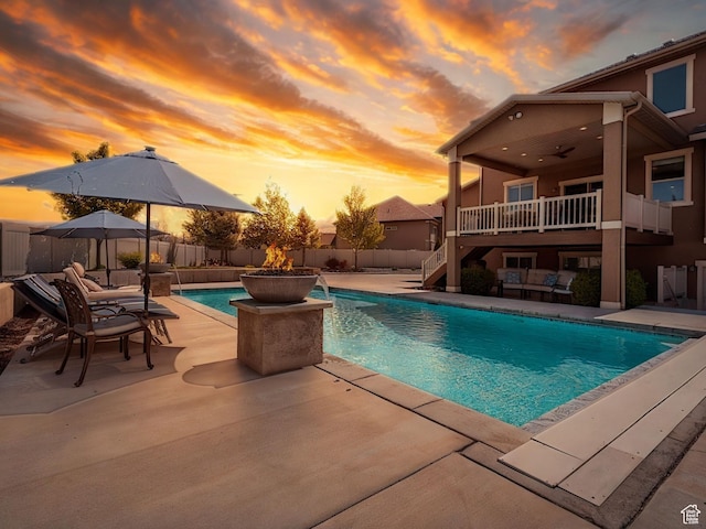 view of swimming pool featuring stairs, a fenced backyard, a fenced in pool, and a patio
