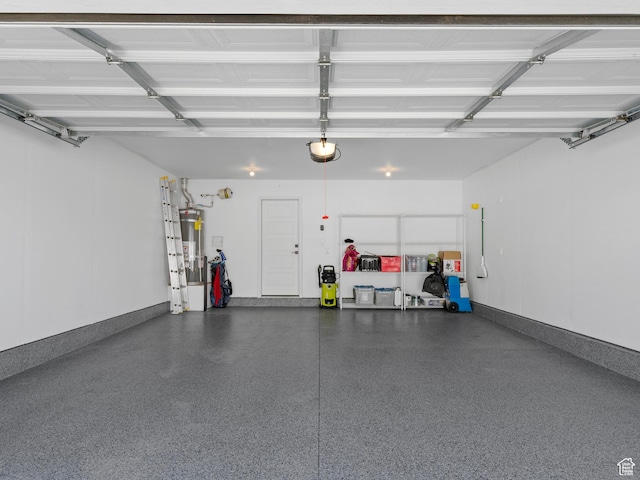 garage with strapped water heater and a garage door opener