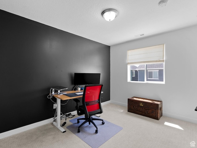 home office featuring carpet floors, baseboards, and visible vents