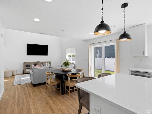 dining room featuring recessed lighting, visible vents, and light wood finished floors