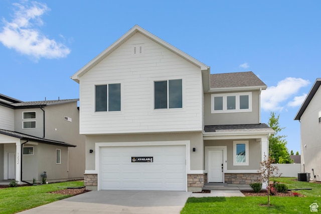 688 N 600 W Unit 104, Tremonton, UT 84337 - view of front of property featuring stone siding, driveway, a shingled roof, and a garage