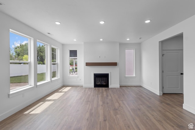 688 N 600 W Unit 104, Tremonton, UT 84337 - unfurnished living room with recessed lighting, wood finished floors, and a fireplace