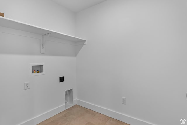 688 N 600 W Unit 104, Tremonton, UT 84337 - washroom with hookup for a washing machine and baseboards