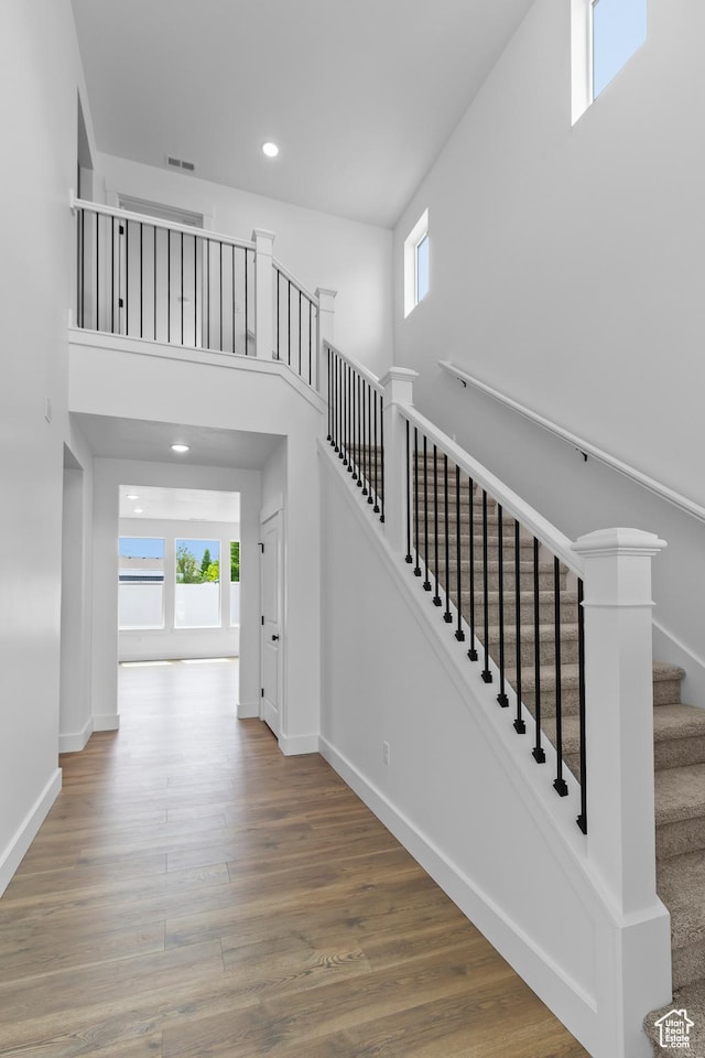 688 N 600 W Unit 104, Tremonton, UT 84337 - stairway featuring wood finished floors, recessed lighting, and a high ceiling