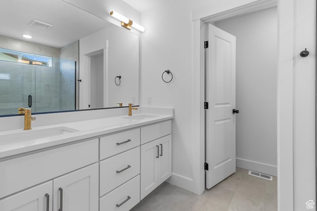 688 N 600 W Unit 104, Tremonton, UT 84337 - bathroom with double vanity, a shower stall, and tile patterned floors