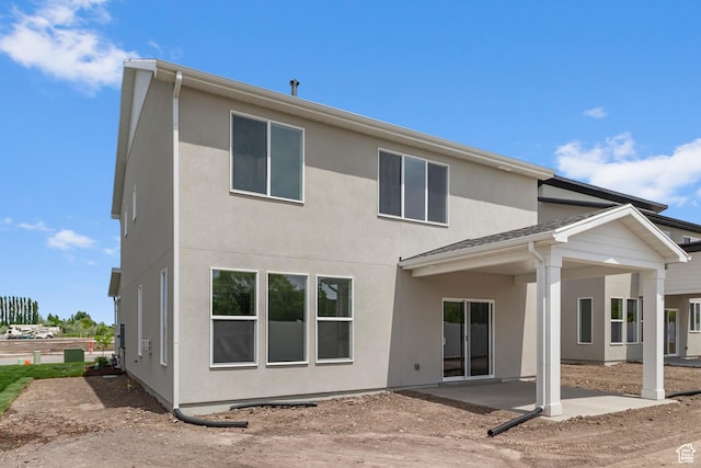 688 N 600 W Unit 104, Tremonton, UT 84337 - back of property with a patio and stucco siding