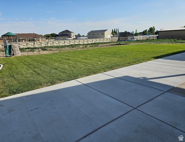 428 S Saddle Rd, Grantsville, UT 84029 - view of yard with a trampoline, a patio area, and a playground