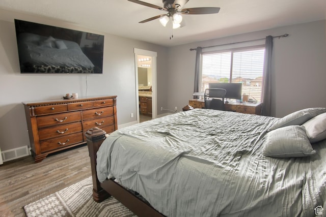 428 S Saddle Rd, Grantsville, UT 84029 - bedroom featuring a ceiling fan, visible vents, baseboards, connected bathroom, and light wood-style flooring