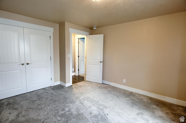428 S Saddle Rd, Grantsville, UT 84029 - unfurnished bedroom with carpet floors, baseboards, and a closet