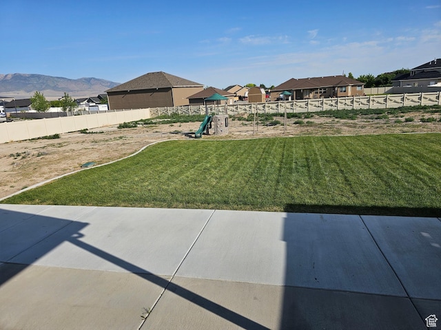 428 S Saddle Rd, Grantsville, UT 84029 - view of yard featuring a playground, a patio area, a residential view, and a mountain view