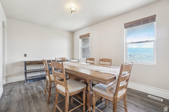 3214 W Ridgeline Rd, Stockton, UT 84071 - dining area with baseboards, wood finished floors, and visible vents