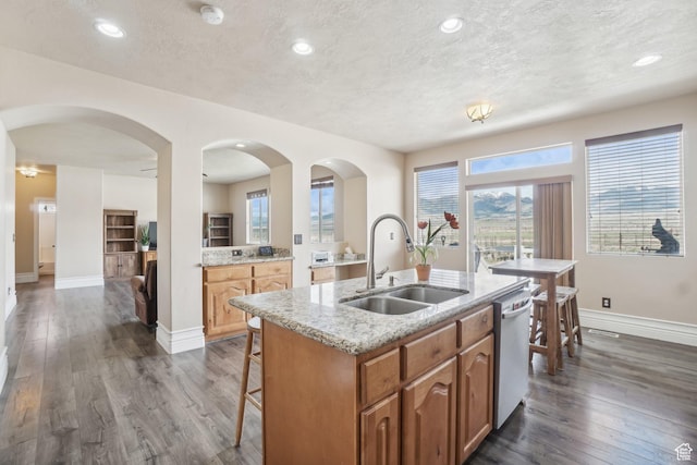 3214 W Ridgeline Rd, Stockton, UT 84071 - kitchen featuring white dishwasher, baseboards, a sink, and dark wood-type flooring