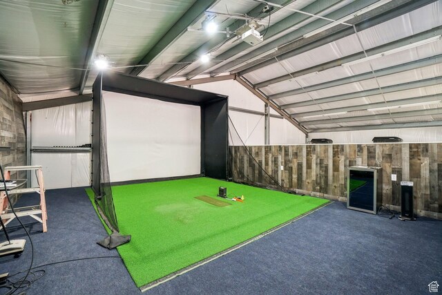 3214 W Ridgeline Rd, Stockton, UT 84071 - playroom featuring golf simulator, vaulted ceiling, wood walls, and carpet
