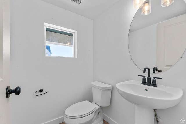 1446 N 3250 W, Provo, UT 84601 - half bath with baseboards, a sink, and toilet