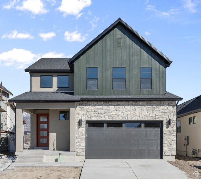 1446 N 3250 W, Provo, UT 84601 - view of front facade featuring a garage, driveway, and stone siding