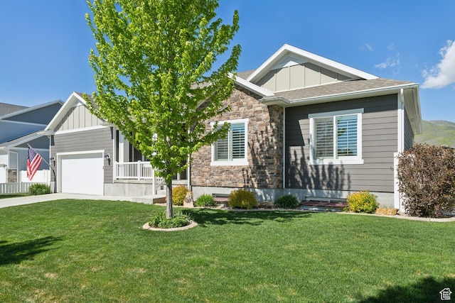 272 S 300 E, Midway, UT 84049 - craftsman-style home featuring board and batten siding, stone siding, concrete driveway, a front lawn, and a garage