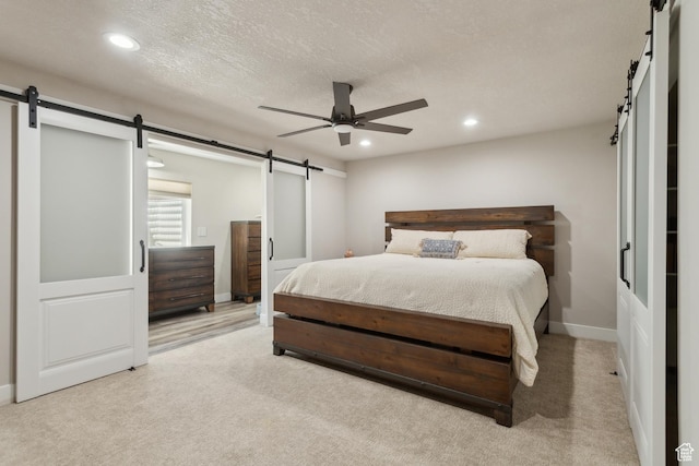 272 S 300 E, Midway, UT 84049 - bedroom with a barn door, recessed lighting, light carpet, ceiling fan, and baseboards