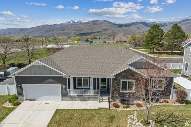 272 S 300 E, Midway, UT 84049 - single story home with fence, an attached garage, board and batten siding, a porch, and a mountain view