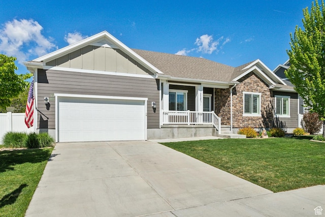272 S 300 E, Midway, UT 84049 - craftsman-style house with covered porch, an attached garage, concrete driveway, board and batten siding, and stone siding