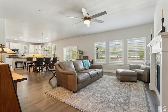272 S 300 E, Midway, UT 84049 - living area with a ceiling fan, a fireplace, wood finished floors, recessed lighting, and baseboards