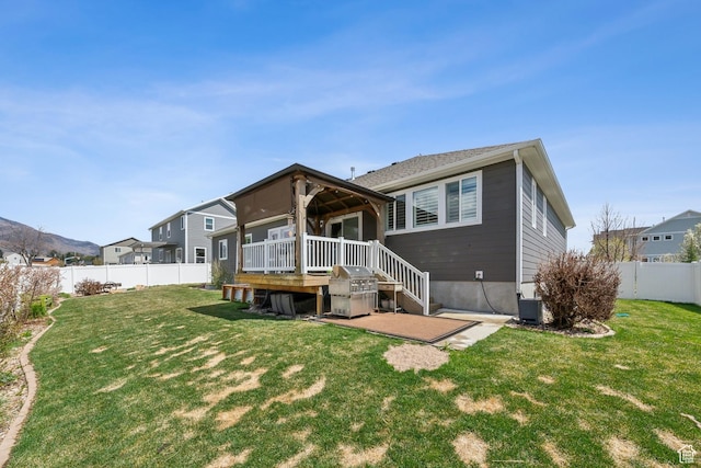 272 S 300 E, Midway, UT 84049 - rear view of property featuring a yard, a wooden deck, a fenced backyard, and central AC unit