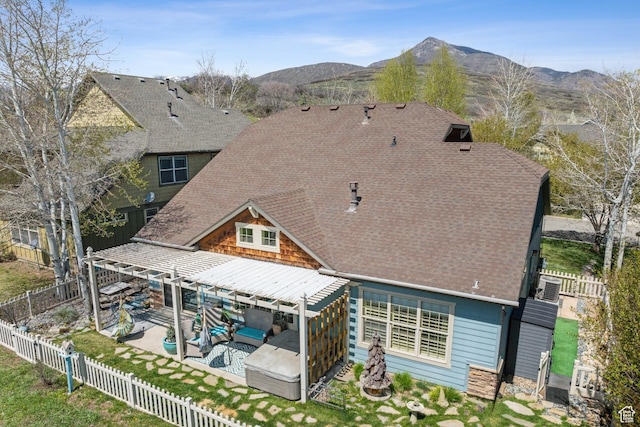 480 E Mission Dr, Midway, UT 84049 - back of house featuring outdoor lounge area, a patio, a fenced backyard, roof with shingles, and a mountain view