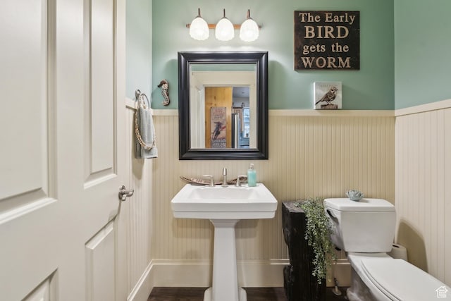480 E Mission Dr, Midway, UT 84049 - half bath featuring a sink, a wainscoted wall, and toilet