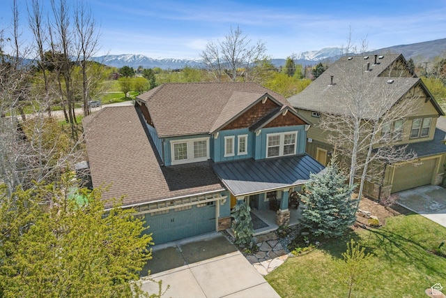 480 E Mission Dr, Midway, UT 84049 - craftsman house with concrete driveway, a standing seam roof, a mountain view, and a porch
