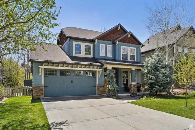 craftsman inspired home featuring a garage, fence, a front yard, a porch, and driveway