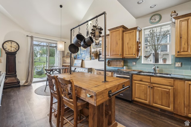 480 E Mission Dr, Midway, UT 84049 - kitchen featuring tasteful backsplash, dark wood finished floors, brown cabinets, dishwasher, and a sink