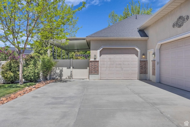 2948 W 150 N, Layton, UT 84041 - view of home's exterior with stucco siding, concrete driveway, brick siding, and an attached garage