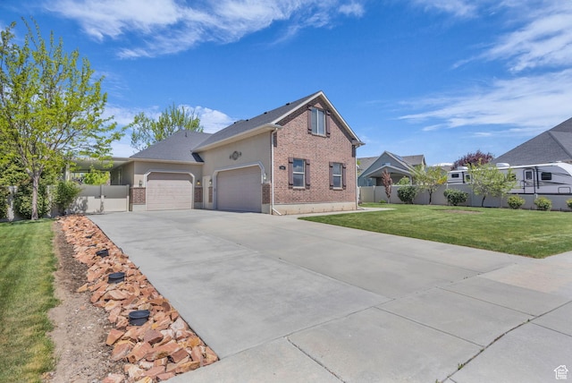 2948 W 150 N, Layton, UT 84041 - view of front of home featuring brick siding, a garage, and driveway