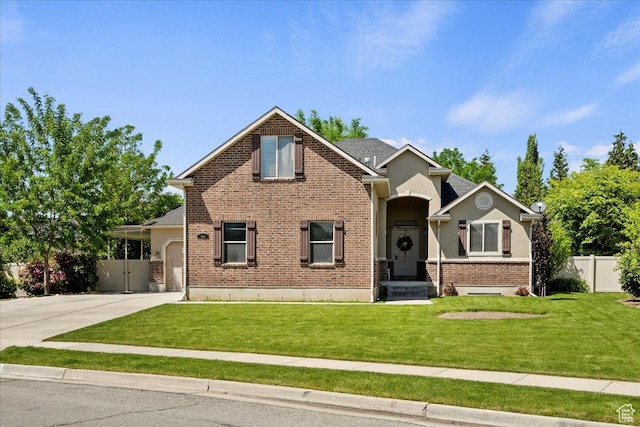 2948 W 150 N, Layton, UT 84041 - view of front of house with driveway, brick siding, and an attached garage