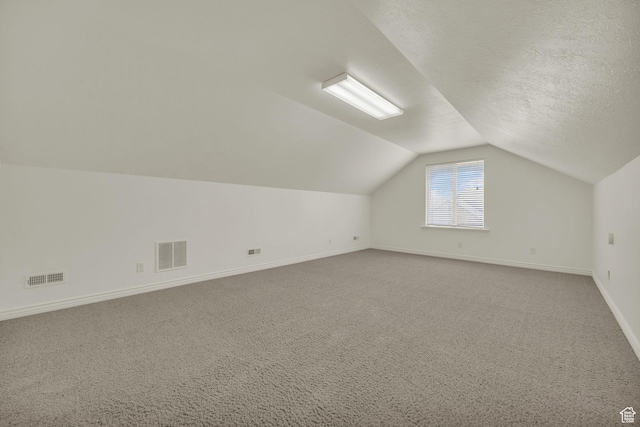 2948 W 150 N, Layton, UT 84041 - bonus room featuring vaulted ceiling, baseboards, carpet, and a textured ceiling