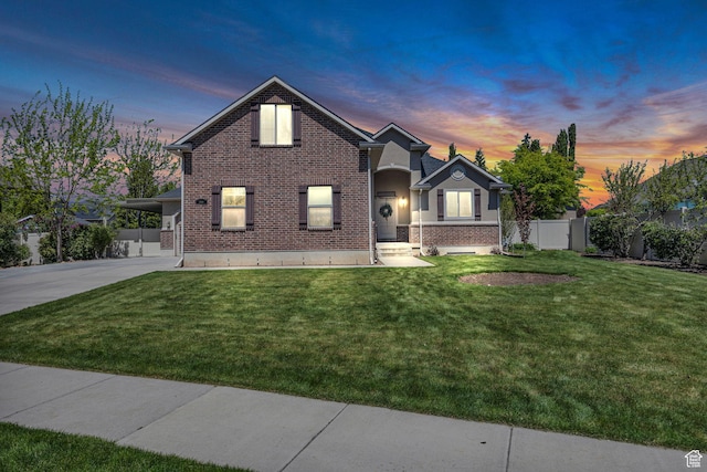 2948 W 150 N, Layton, UT 84041 - view of front of house with brick siding, concrete driveway, and a carport