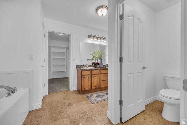 2948 W 150 N, Layton, UT 84041 - full bathroom featuring vanity, a garden tub, toilet, and baseboards
