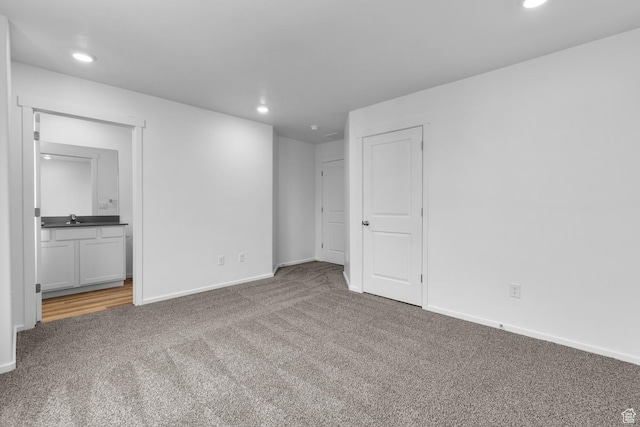 1914 E Thunder Ln N Unit 505, Eagle Mountain, UT 84005 - interior space featuring carpet floors, a sink, baseboards, and recessed lighting