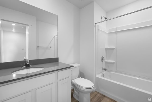 1914 E Thunder Ln N Unit 505, Eagle Mountain, UT 84005 - bathroom featuring vanity, wood finished floors, toilet, and shower / washtub combination