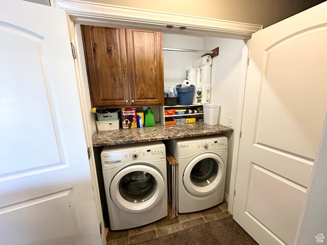 515 S Stump Hollow Rd, Garden City, UT 84028 - laundry area featuring independent washer and dryer, cabinet space, and dark tile patterned floors