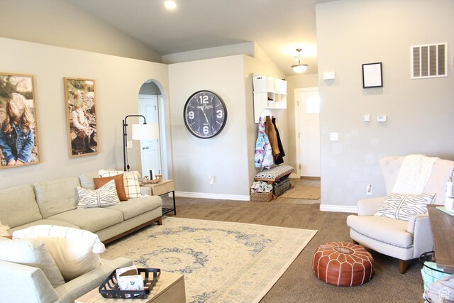515 S Stump Hollow Rd, Garden City, UT 84028 - carpeted living area with lofted ceiling, arched walkways, and baseboards