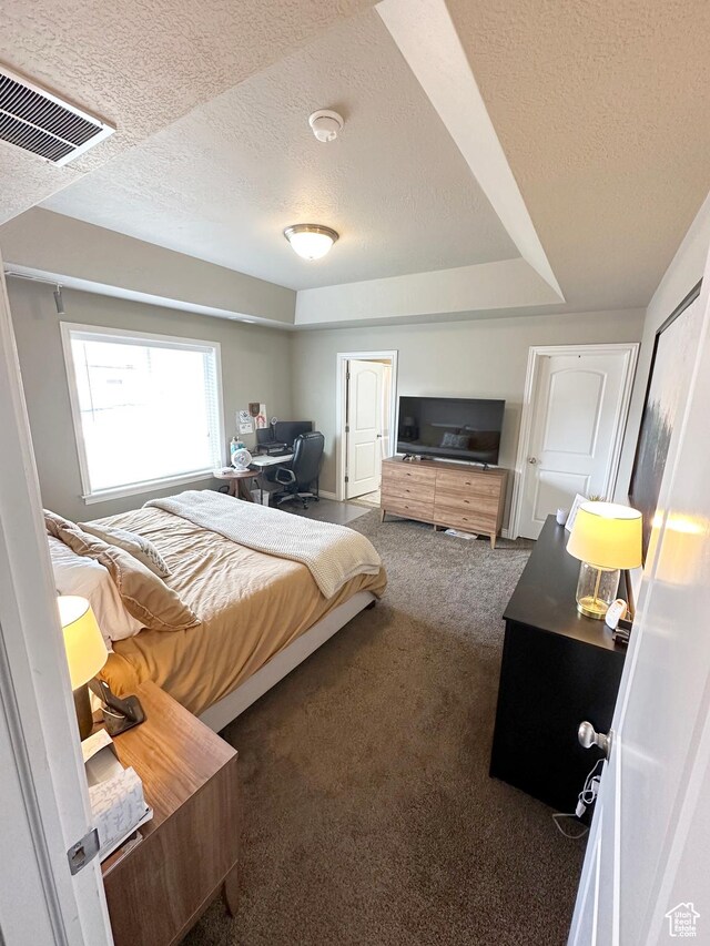 515 S Stump Hollow Rd, Garden City, UT 84028 - carpeted bedroom featuring a textured ceiling